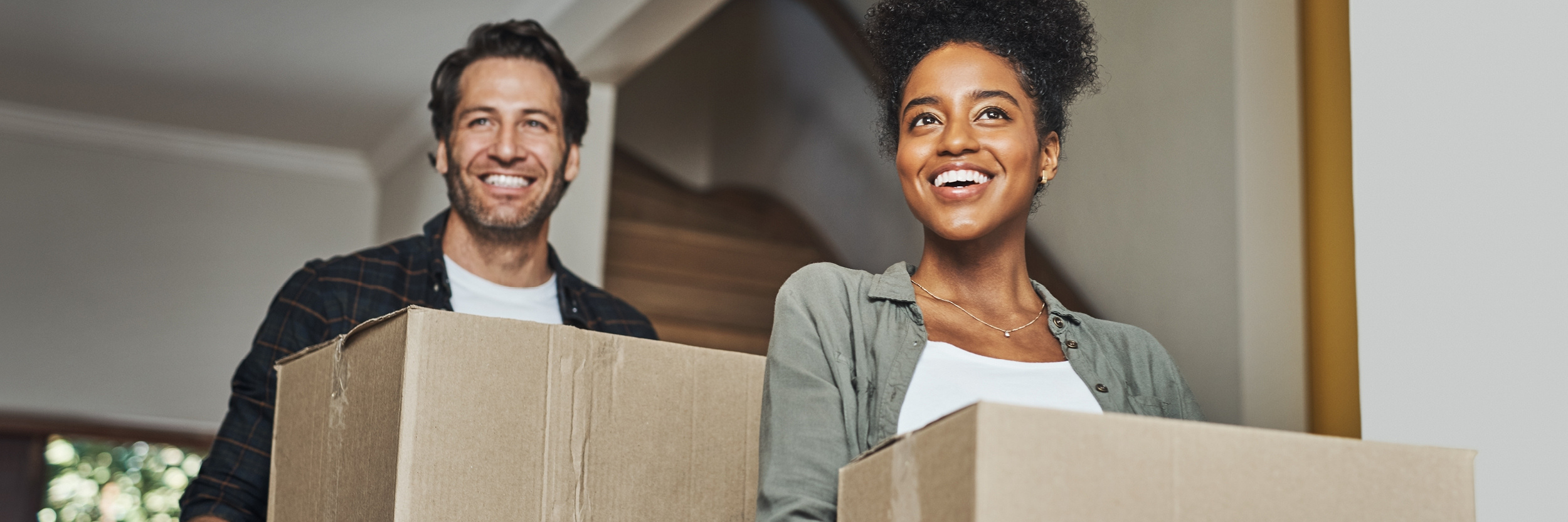 First-time homebuyers unloading boxes