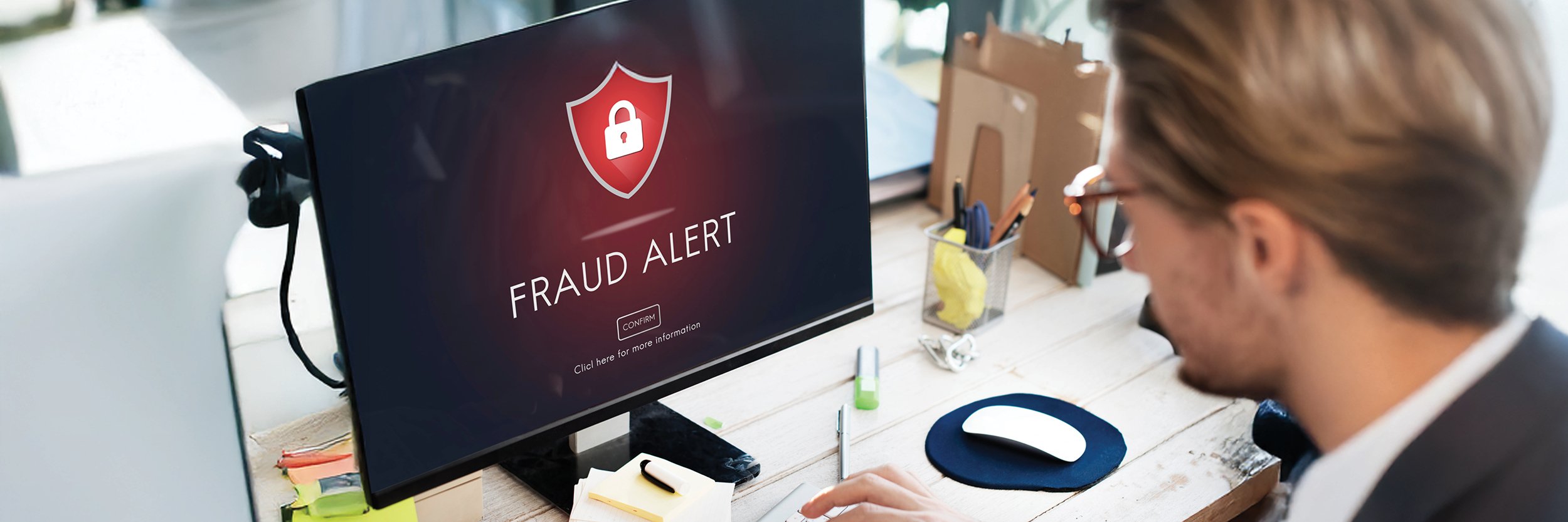 Fraud alert on computer screen