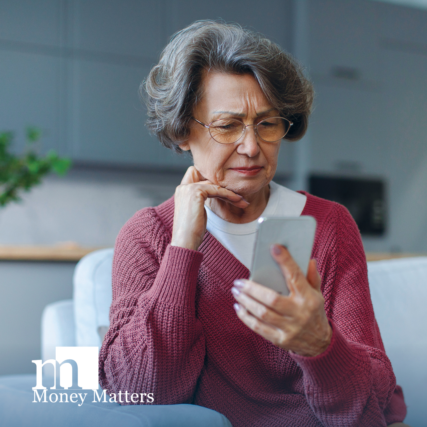 Bank customer looking at scam on phone
