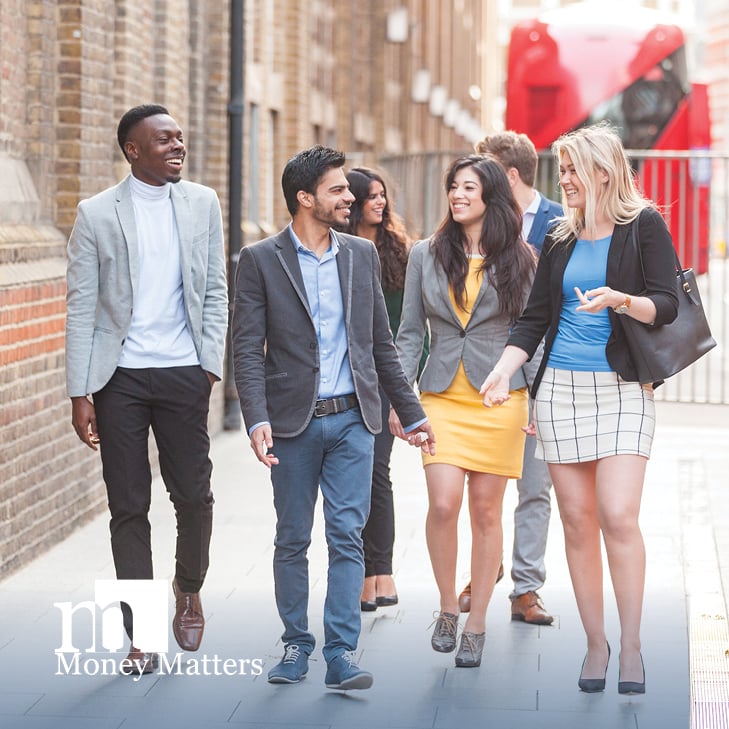 A group of young adults walk together.